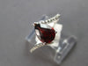 1.18CT DIAMOND & AAA GARNET 14KT WHITE GOLD PEAR SHAPE & ROUND CRISS CROSS RING