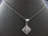 .75CT DIAMOND 14KT WHITE GOLD ROUND & PRINCESS INVISIBLE SQUARE FLOATING PENDANT