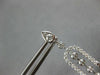 LONG 1.25CT DIAMOND 14KT WHITE GOLD ROUND & BAGUETTE HORSESHOE HANGING EARRINGS