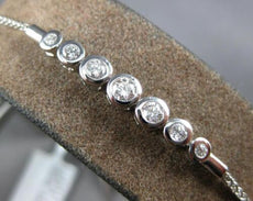 .34CT DIAMOND 18K WHITE GOLD 7 STONE BEZEL GRADUATING ADJUSTABLE TENNIS BRACELET