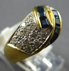 1.20CT DIAMOND & AAA SAPPHIRE 18KT YELLOW GOLD ROUND & BAGUETTE CRISS CROSS RING