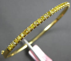 1.1CT INTENSE FANCY YELLOW DIAMOND 18KT YELLOW GOLD SHARED PRONG BANGLE BRACELET