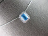 1.34CT DIAMOND & AAA BLUE TOPAZ 14KT WHITE GOLD EMERALD CUT & ROUND HALO PENDANT