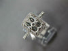 WIDE .83CT DIAMOND 18KT WHITE GOLD ROUND & BAGUETTE RECTANGULAR HALO LOVE RING
