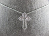 SMALL .52CT DIAMOND 14KT WHITE GOLD 3D ROUND & BAGUETTE CROSS FLOATING PENDANT