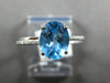 1.57CT DIAMOND & AAA BLUE TOPAZ 18KT WHITE GOLD OVAL & ROUND FILIGREE LOVE RING