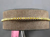 .91CT INTENSE FANCY YELLOW DIAMOND 18KT YELLOW GOLD 2MM FILIGREE BANGLE BRACELET