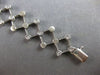 ESTATE .52CT DIAMOND 14K WHITE GOLD BEZEL ETOILE CRISS CROSS FUN TENNIS BRACELET