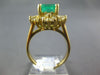 ESTATE 3.20CT DIAMOND & AAA EMERALD 18KT WHITE GOLD ROUND & BAGUETTE FLOWER RING