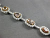 LARGE GIA 6.56CT MULTI COLOR DIAMOND 18KT WHITE & ROSE GOLD HALO TENNIS BRACELET