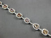 LARGE GIA 6.56CT MULTI COLOR DIAMOND 18KT WHITE & ROSE GOLD HALO TENNIS BRACELET