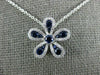 ESTATE .63CT DIAMOND & AAA SAPPHIRE 18KT WHITE GOLD FLOWER FLOATING LOVE PENDANT