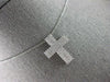 ESTATE. 75CT DIAMOND 18KT WHITE GOLD 3D CLASSIC THREE ROW CROSS FLOATING PENDANT