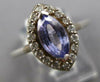 1.11CT DIAMOND & AAA TANZANITE 14KT WHITE GOLD MARQUISE & ROUND ENGAGEMENT RING