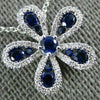 ESTATE .63CT DIAMOND & AAA SAPPHIRE 18KT WHITE GOLD FLOWER FLOATING LOVE PENDANT