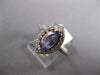1.11CT DIAMOND & AAA TANZANITE 14KT WHITE GOLD MARQUISE & ROUND ENGAGEMENT RING