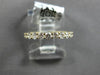 ESTATE .16CT DIAMOND 18KT WHITE GOLD ROUND BEZEL GRADUATING 7 STONE WEDDING RING