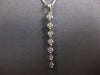 .65CT DIAMOND 18KT WHITE GOLD 3D ROUND SHARED PRONG JOURNEY BAR FLOATING PENDANT
