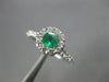 ESTATE .87CT DIAMOND & AAA EMERALD 14KT WHITE GOLD CLASSIC ROUND FLOWER FUN RING