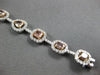 LARGE GIA 6.56CT MULTI COLOR DIAMOND 18KT WHITE & ROSE GOLD HALO TENNIS BRACELET