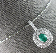 1.15CT DIAMOND & AAA EMERALD 18KT WHITE GOLD OVAL & ROUND HALO FLOATING PENDANT
