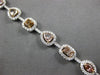 LARGE GIA 6.56CT MULTI COLOR DIAMOND 18KT WHITE & ROSE GOLD HALO TENNIS BRACELET