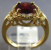 ESTATE 2.64CT DIAMOND & AAA GARNET 14KT YELLOW GOLD OVAL & ROUND LOVE KNOT RING