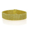 LARGE 57.46CT FANCY YELLOW DIAMOND 18KT YELLOW GOLD CUSHION CUFF TENNIS BRACELET