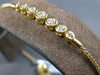 .34CT DIAMOND 18KT YELLOW GOLD 3D BEZEL 7 STONE GRADUATING LOVE TENNIS BRACELET