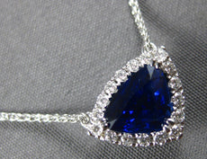 2.17CT DIAMOND & AAA SAPPHIRE 18K WHITE GOLD TRILLION & ROUND HALO LOVE NECKLACE