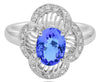 1.96CT DIAMOND & AAA TANZANITE 18KT WHITE GOLD OVAL & ROUND FILIGREE FLOWER RING