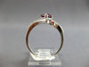 1.18CT DIAMOND & AAA GARNET 14KT WHITE GOLD PEAR SHAPE & ROUND CRISS CROSS RING