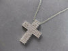 ESTATE. 75CT DIAMOND 18KT WHITE GOLD 3D CLASSIC THREE ROW CROSS FLOATING PENDANT