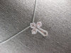 SMALL .52CT DIAMOND 14KT WHITE GOLD 3D ROUND & BAGUETTE CROSS FLOATING PENDANT