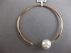 .06CT DIAMOND & AAA SOUTH SEA PEARL 18KT ROSE GOLD FLEXIBLE 3D BANGLE BRACELET
