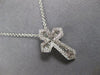SMALL .52CT DIAMOND 14KT WHITE GOLD 3D ROUND & BAGUETTE CROSS FLOATING PENDANT