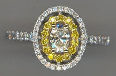 .77CT WHITE & FANCY YELLOW DIAMOND 18KT WHITE GOLD OVAL & ROUND ENGAGEMENT RING
