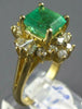 ESTATE 3.20CT DIAMOND & AAA EMERALD 18KT WHITE GOLD ROUND & BAGUETTE FLOWER RING