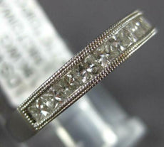 .58CT DIAMOND 18KT WHITE GOLD ROUND & PRINCESS CHANNEL FILIGREE ANNIVERSARY RING