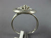 ESTATE .19CT DIAMOND 18KT WHITE GOLD 3D MATTE & SHINY FLOWER CIRCULAR FUN RING