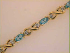 3.81CT DIAMOND & AAA BLUE TOPAZ 14KT YELLOW GOLD OVAL & ROUND XO TENNIS BRACELET