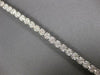 ESTATE WIDE 4.05CT DIAMOND 14KT WHITE GOLD CLUSTER ROUND 4 PRONG TENNIS BRACELET