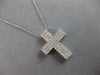 ESTATE. 75CT DIAMOND 18KT WHITE GOLD 3D CLASSIC THREE ROW CROSS FLOATING PENDANT
