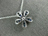 ESTATE .63CT DIAMOND & AAA SAPPHIRE 18KT WHITE GOLD FLOWER FLOATING LOVE PENDANT