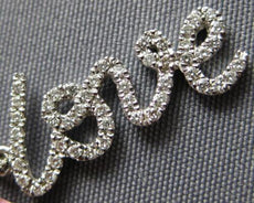 ESTATE .16CT DIAMOND 14KT WHITE GOLD 3D SCRIPT LOVE FLOATING PENDANT