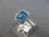 1.44CT DIAMOND & AAA BLUE TOPAZ 14KT WHITE GOLD 3D EMERALD CUT & ROUND HALO RING