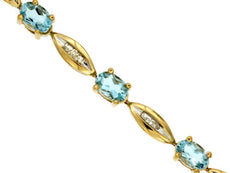 5.05CT DIAMOND & AAA AQUAMARINE 14KT YELLOW GOLD OVAL & BAGUETTE TENNIS BRACELET