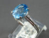 1.57CT DIAMOND & AAA BLUE TOPAZ 18KT WHITE GOLD OVAL & ROUND FILIGREE LOVE RING