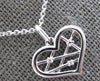 ESTATE .01CT DIAMOND 14K WHITE GOLD ROUND CRISS CROSS HEART FUN FLOATING PENDANT