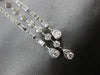 LONG 1.25CT DIAMOND 14KT WHITE GOLD ROUND & BAGUETTE HORSESHOE HANGING EARRINGS
